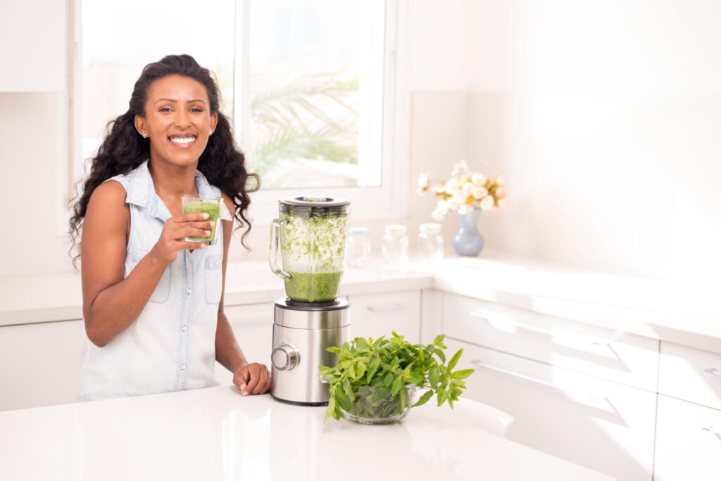Woman enjoying a refreshing Avocado Energy Drink as part of a healthy lifestyle